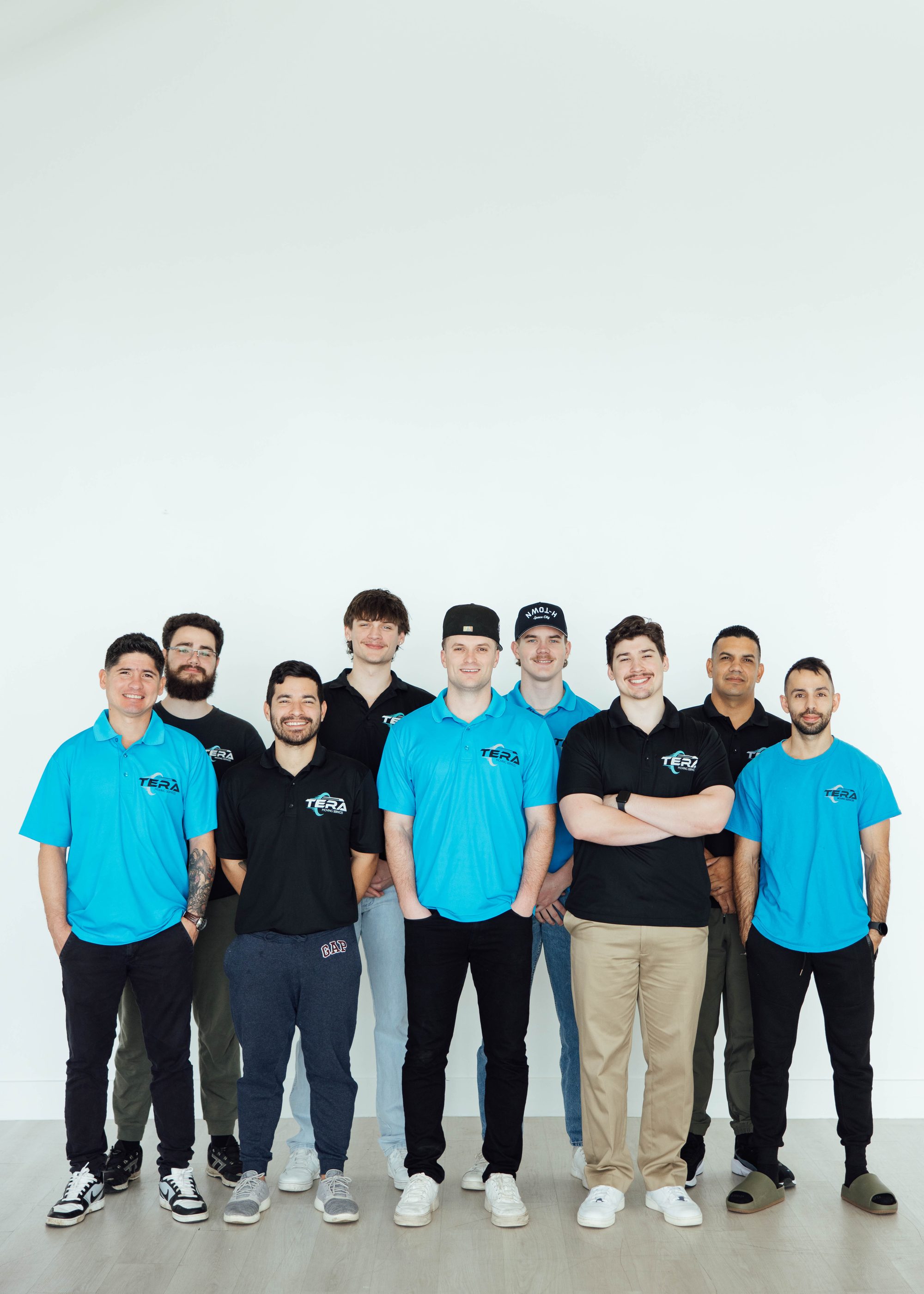 The Tera Moving Services crew in branded polos