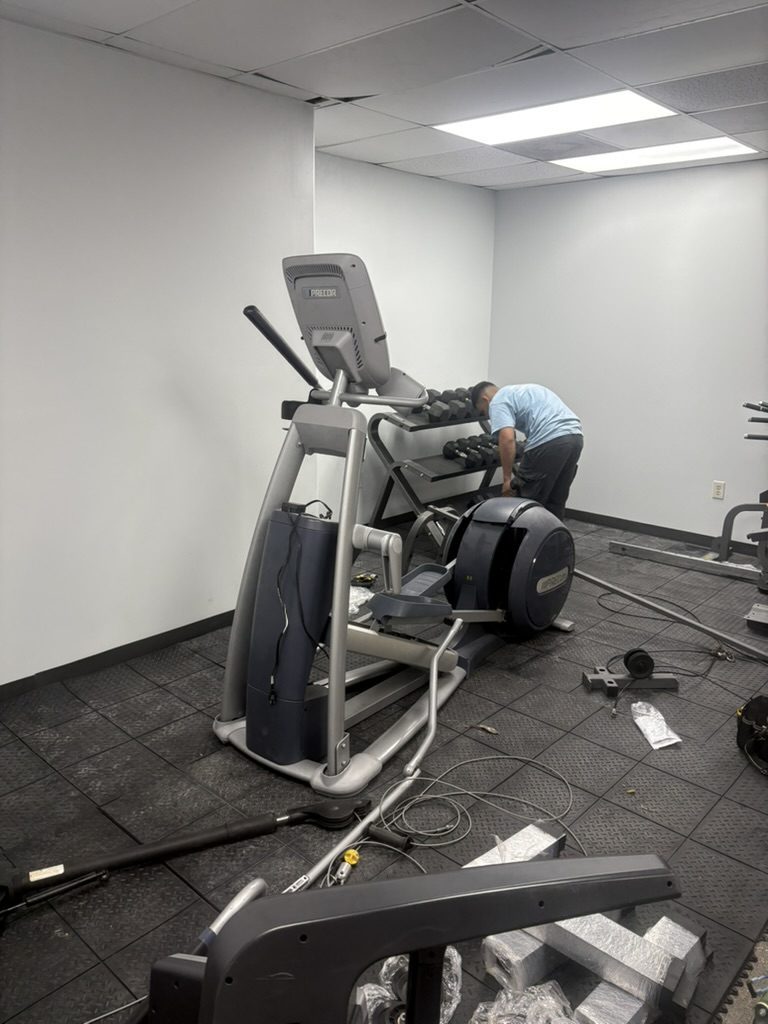 Tera Moving crew handling commercial gym equipment during a move
