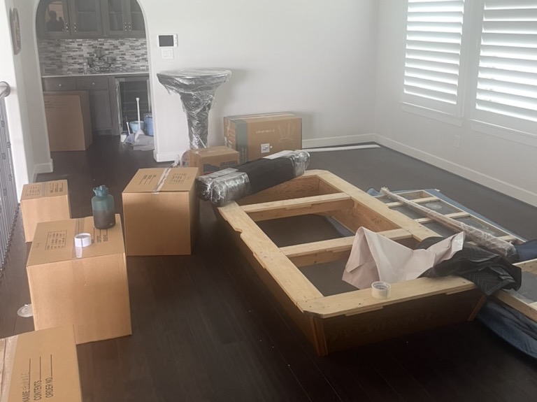 Team of Tera Moving Services transporting gym equipment in Houston, TX