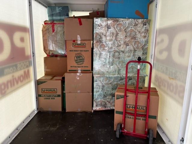 Carefully packed moving boxes arranged in a van, showcasing Tera Moving Services' commitment to secure and efficient transportation.