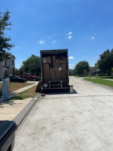 Tera Moving Services: Professional Movers Loading Boxes into Truck in Sugar Land, Houston